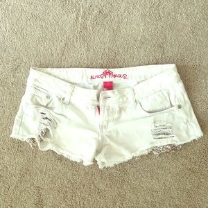 Distressed white denim shorts